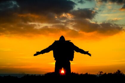 silhouette of man spreading its arm