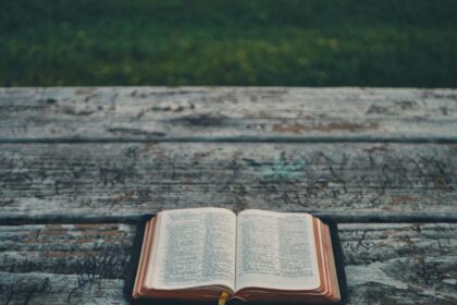 black book on gray wooden table