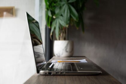 turned-off gray laptop computer on table